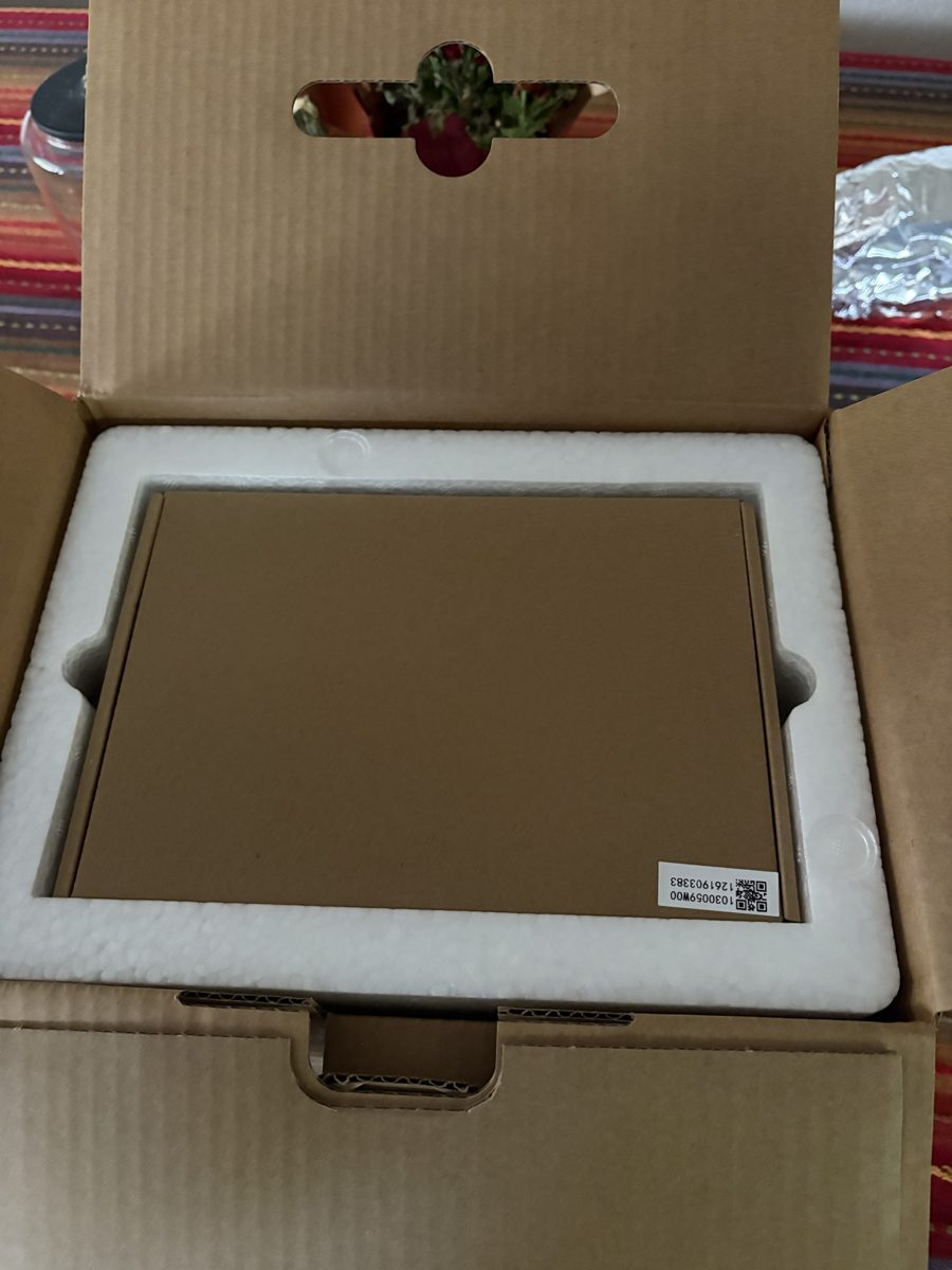 Retail box open showing foam insert and accessory box