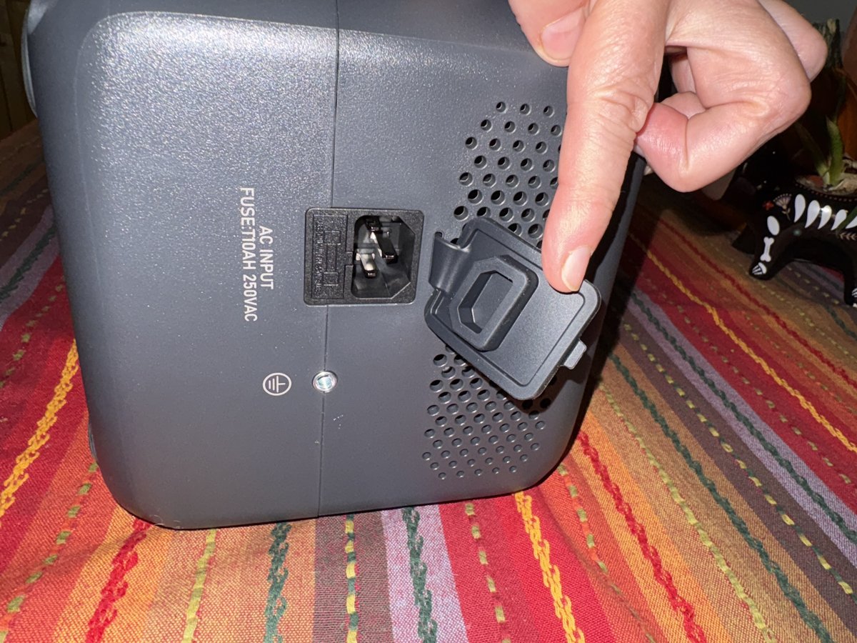 Side panel with AC input socket, fuse and grounding screw