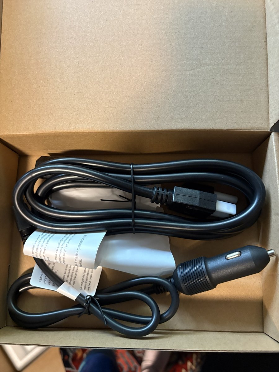 Accessory box with AC charging cord and car charging cable
